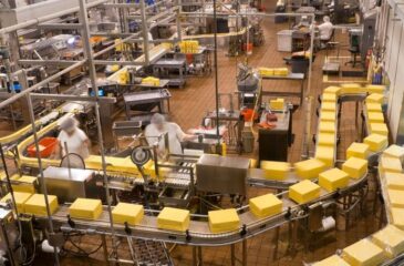 Toll manufacturing facility processing packaged food products on automated production line