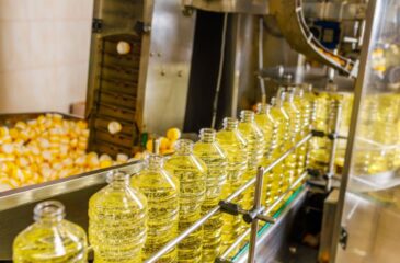 Toll manufacturing production line filling bottles with liquid products at scale