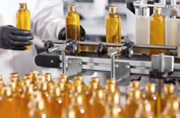 Contract manufacturer production line filling bottles in automated packaging process